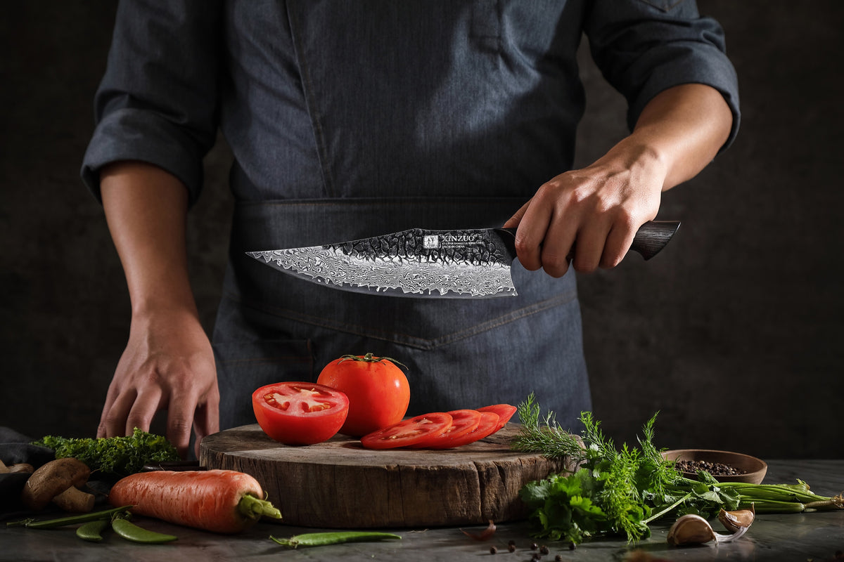 Cocinero cortando con cuchillo Xinzuo